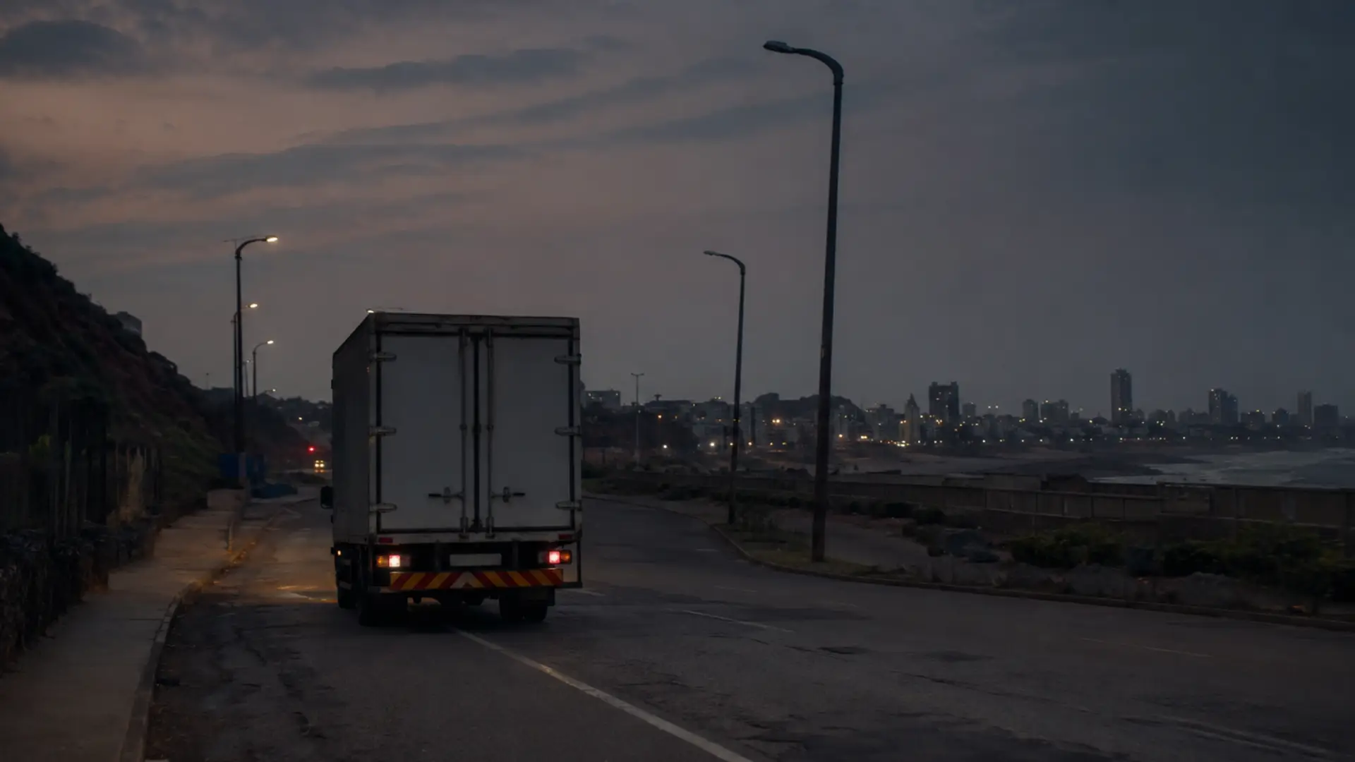 Durban fleet road safety — a delivery truck driving at night on a poorly lit Durban road
