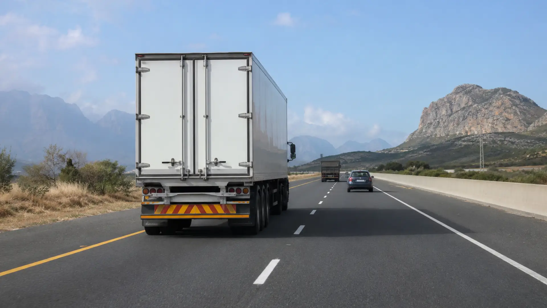 Fleet road safety technology — a commercial truck travelling safely on a South African highway with clear road markings